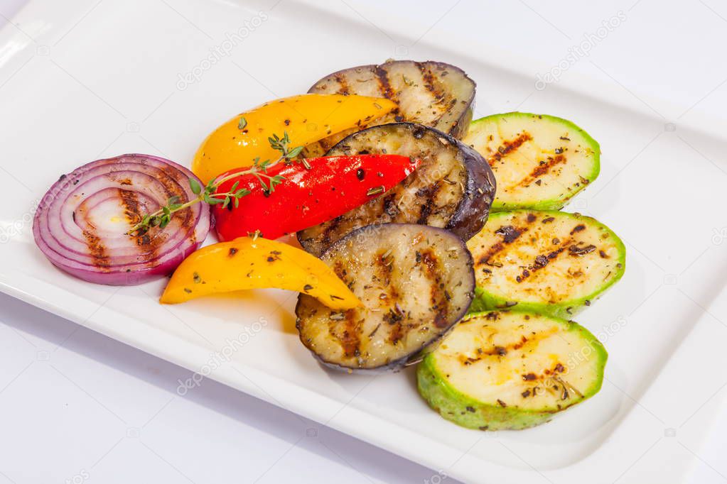 Grilled vegetables on white plate