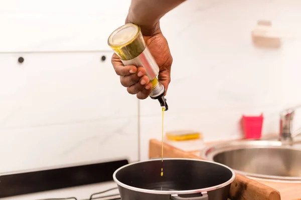 Black African American couple preparing food in the kitchen