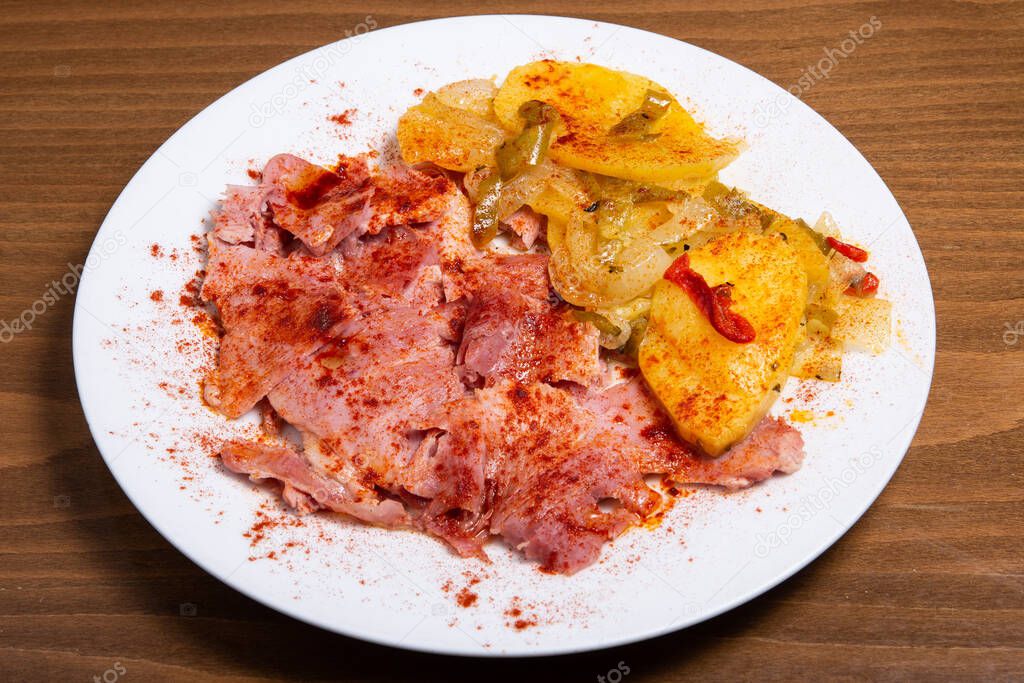 Tasty lacon galician boiled ham on a plate.