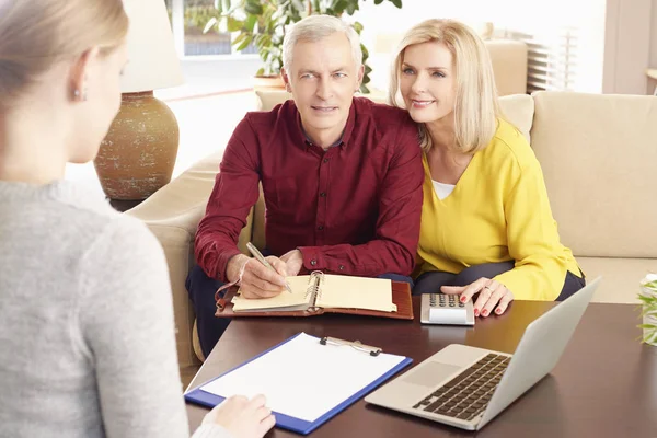 Investment advisor and her senior clients — Stock Photo, Image