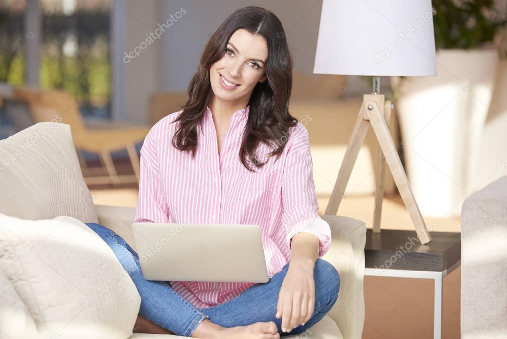 young woman using her laptop