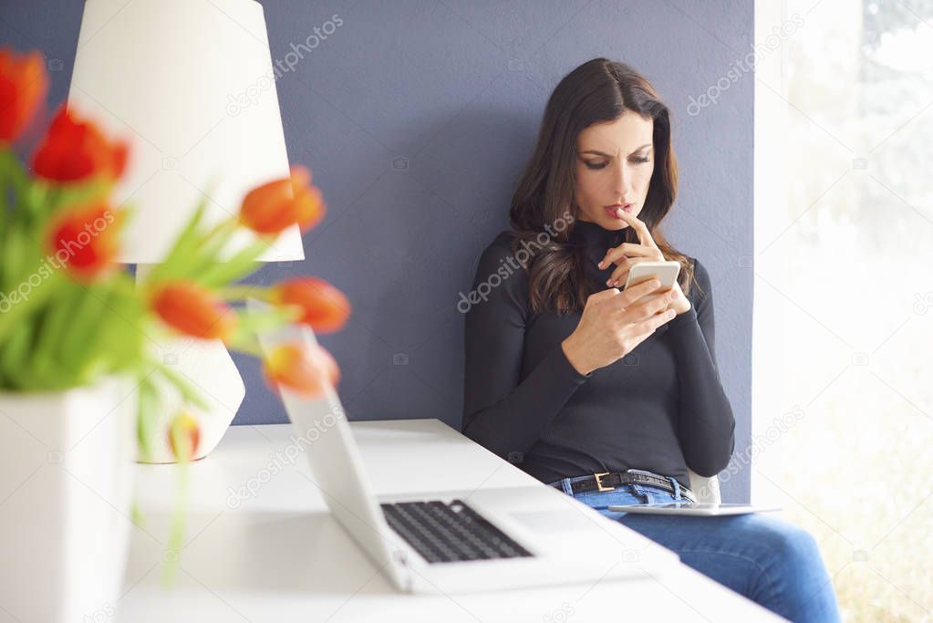 female using her mobile phone