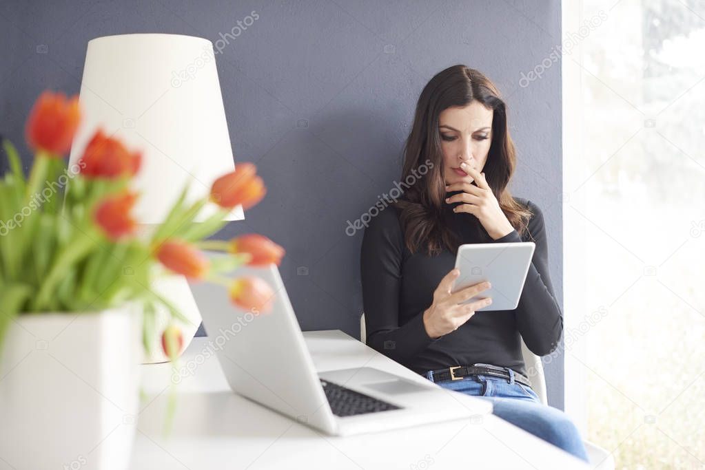 businesswoman using her digital tablet
