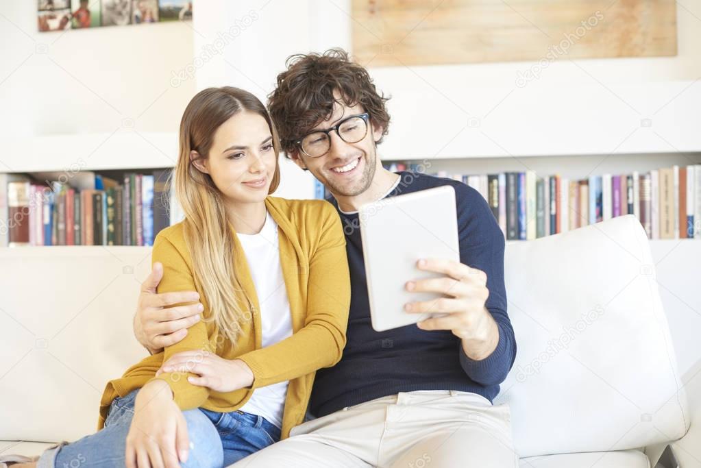 couple using digital tablet