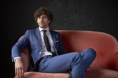 businessman relaxing on sofa