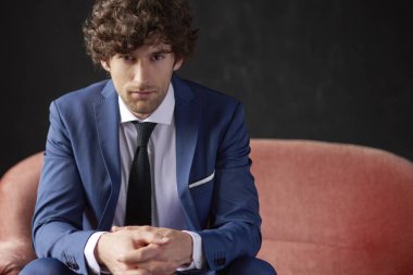 businessman relaxing on sofa