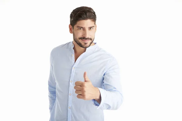 Young man giving thumbs up — Stock Photo, Image