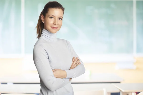 Lovely Mature Female Teacher Standing Arms Crossed Front Chalkboard Classroom — Stock Photo, Image