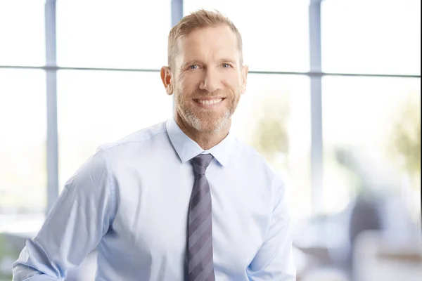 Portrait Businessman Toothy Smile Standing Officde Looking Camera — Stock Photo, Image