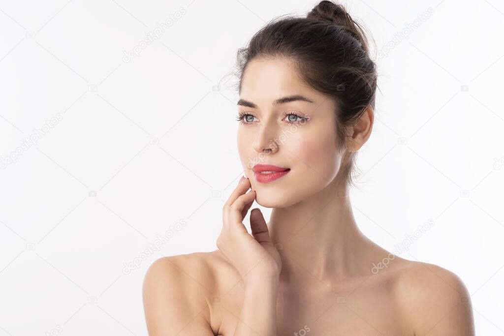 Close-up portrait of beautiful woman with flawless skin wearing red lipstick while standing at isolated white background. 