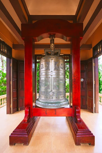Big Buddhist bell cast in the image in the temple. Royalty Free Stock Images