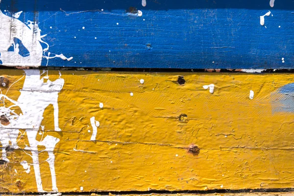 Textura de tinta descascada azul e amarela — Fotografia de Stock