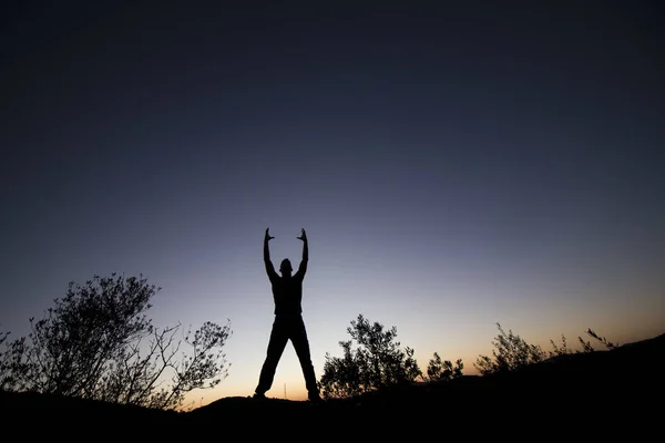 Top of hill man silhouette — Stock Photo, Image