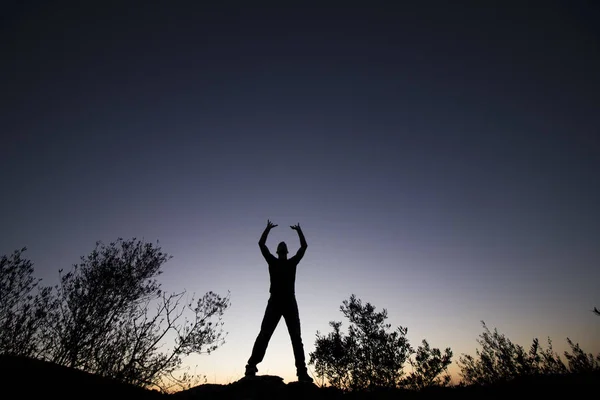 Top of hill man silhouette — Stock Photo, Image