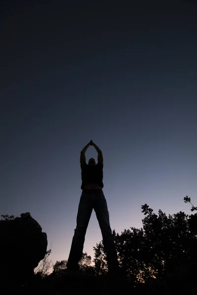 Top of hill man silhouette — Stock Photo, Image