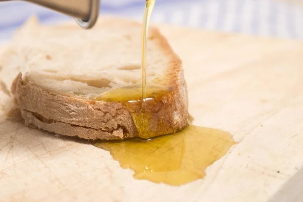 Olive oil on traditional bread — Stock Photo, Image