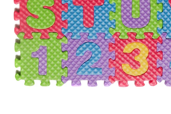 Foam puzzle numbers and letters — Stock Photo, Image