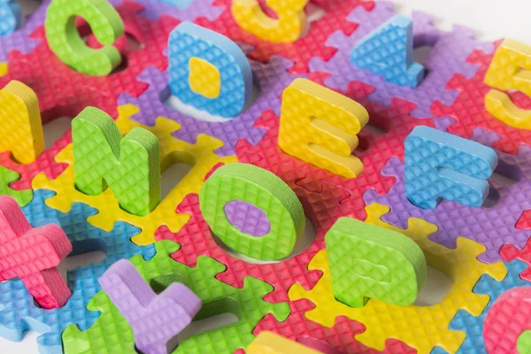 Foam puzzel brief hoofdletters — Stockfoto