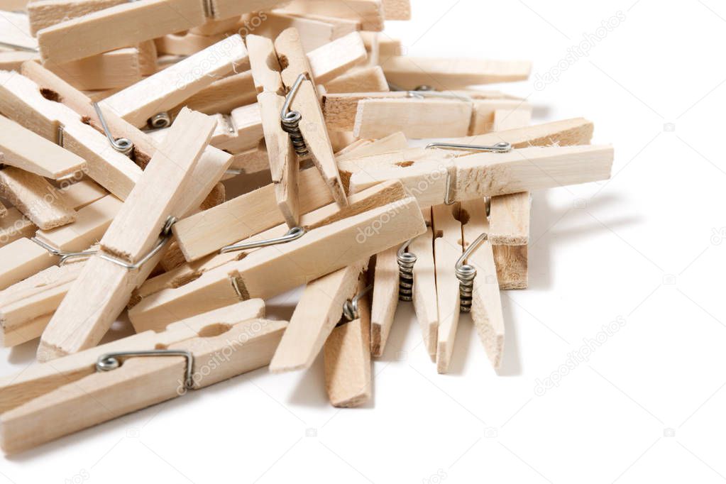 Pile of clothing pegs isolated on white background