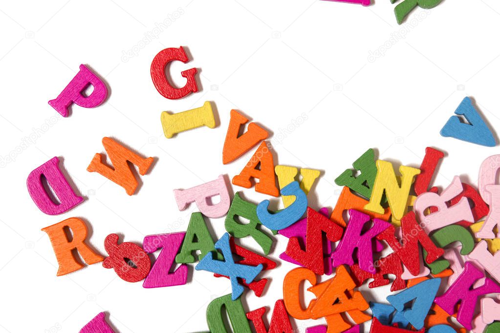 Wooden colorful letters isolated on a white background.