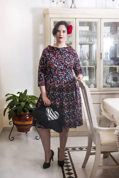 Girl posing with vintage clothing inside on luxurious house.