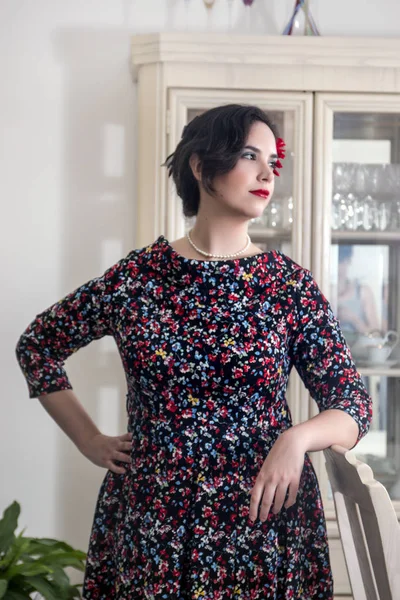 Girl posing with vintage clothing inside on luxurious house.