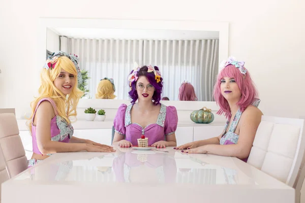 Pinup girls with colorful outfits on a table.
