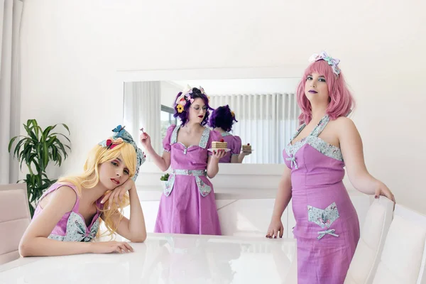 Pinup girls with colorful outfits on a table. — 스톡 사진