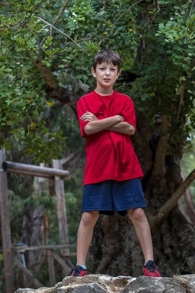 Cute boy posing with sport clothing — Stock Photo, Image