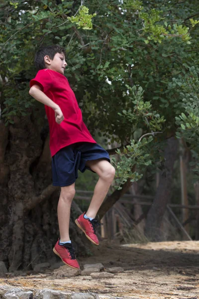 Cute boy jumping — Stock Photo, Image