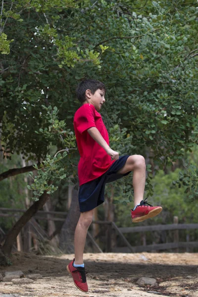 Cute boy jumping — Stock Photo, Image