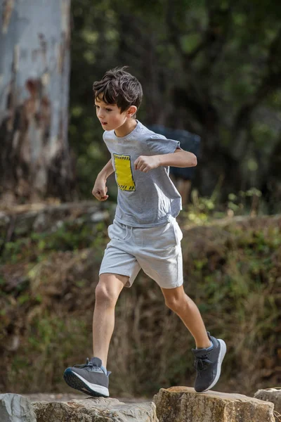 Cute boy outdoor running — Stock Photo, Image