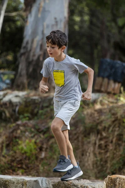 Cute boy outdoor running — Stock Photo, Image