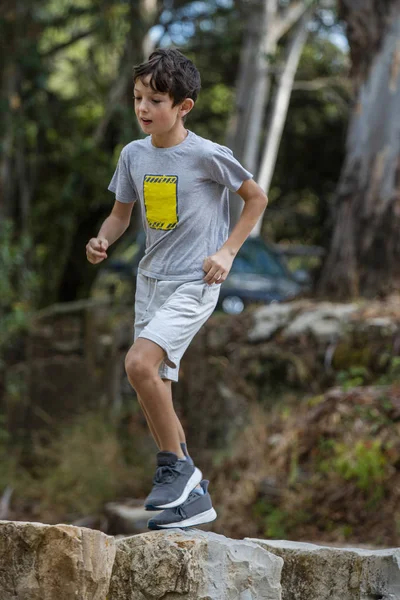 Cute boy outdoor running — Stock Photo, Image