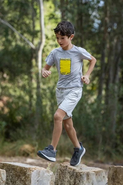 Cute boy outdoor running — Stock Photo, Image