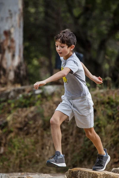 Cute boy outdoor running — Stock Photo, Image
