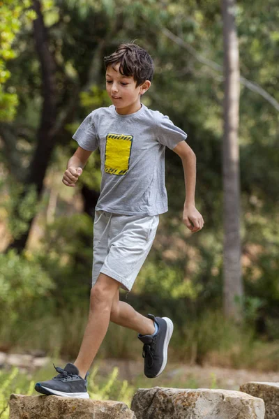 Cute boy outdoor running — Stock Photo, Image