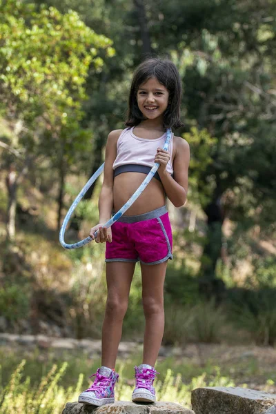 Cute girl posing with hula hoop — Stock Photo, Image