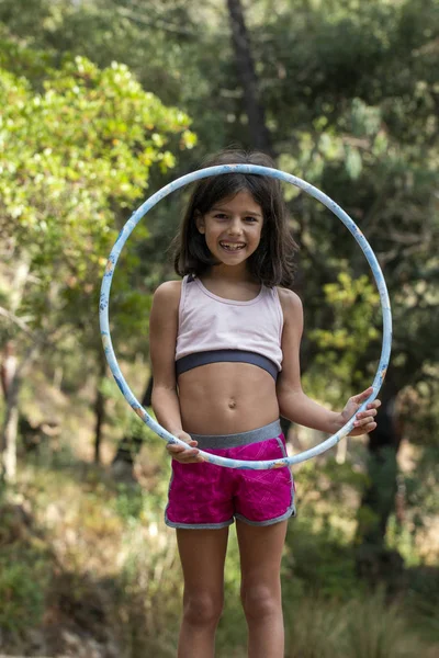 Cute girl posing with hula hoop — Stock Photo, Image