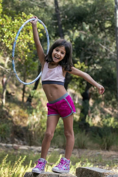 Cute girl posing with hula hoop — Stock Photo, Image