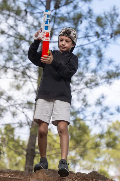 Cute boy with water gun — Stock Photo, Image