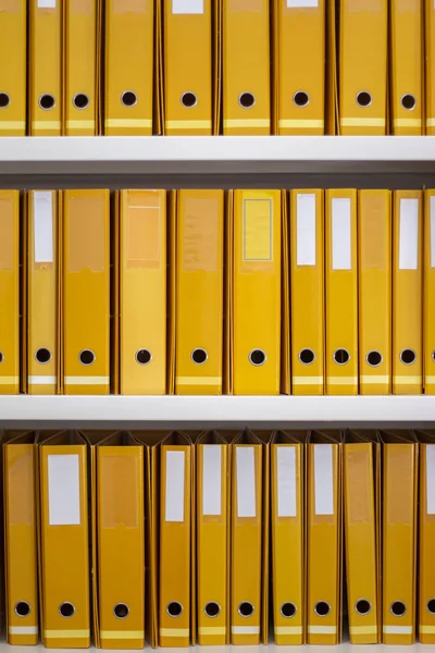 Aligned yellow binders — 스톡 사진