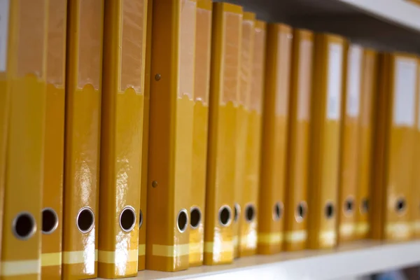 Aligned yellow binders — 스톡 사진