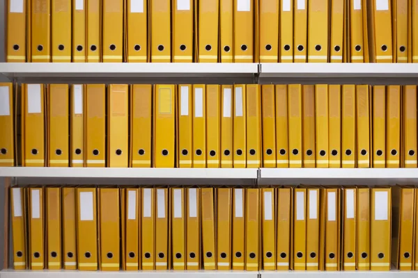 Aligned yellow binders — 스톡 사진