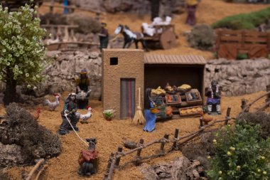 VILA REAL SANTO ANTONIO, PORTUGAL - 28th DECEMBER 2019: Christmas Nativity scene exhibition of many figurines depicting daily life across different business and religious activities.