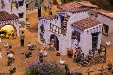 VILA REAL SANTO ANTONIO, PORTUGAL - 28th DECEMBER 2019: Christmas Nativity scene exhibition of many figurines depicting daily life across different business and religious activities.