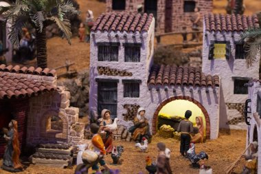 VILA REAL SANTO ANTONIO, PORTUGAL - 28th DECEMBER 2019: Christmas Nativity scene exhibition of many figurines depicting daily life across different business and religious activities.