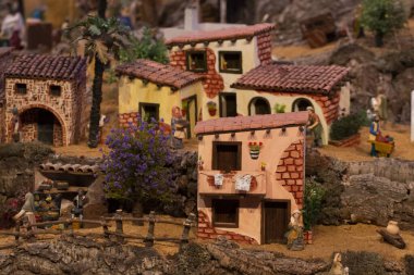 VILA REAL SANTO ANTONIO, PORTUGAL - 28th DECEMBER 2019: Christmas Nativity scene exhibition of many figurines depicting daily life across different business and religious activities.