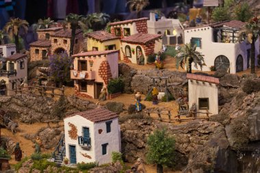 VILA REAL SANTO ANTONIO, PORTUGAL - 28th DECEMBER 2019: Christmas Nativity scene exhibition of many figurines depicting daily life across different business and religious activities.