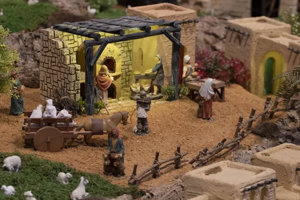 VILA REAL SANTO ANTONIO, PORTUGAL - 28th DECEMBER 2019: Christmas Nativity scene exhibition of many figurines depicting daily life across different business and religious activities.